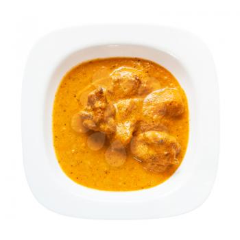 Indian cuisine - Murg Makhan Masala barbequed chicken pieces in spicy tomato and creamy curry sauce in white bowl isolated on white background