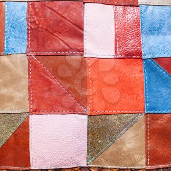 patchwork pattern from various leather pieces on leather decorative pillow