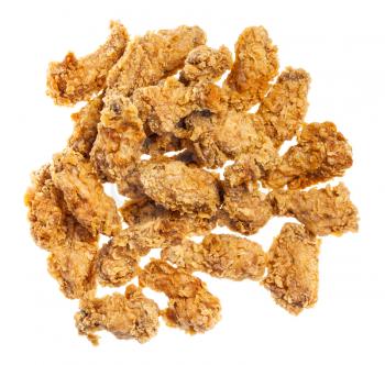 top view of pile of crispy batter deep-fried chicken wings isolated on white background