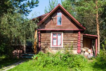 front view of country log house on sunny summer day in Tver region of Russia