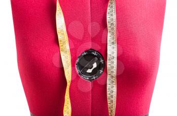 front view of red dress form with measuring tape close up isolated on white background
