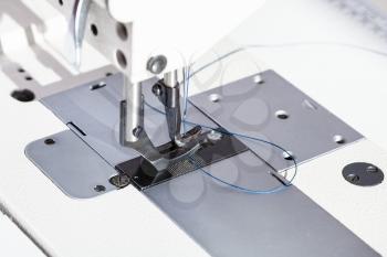 steel presser foot of industrial sewing machine close up