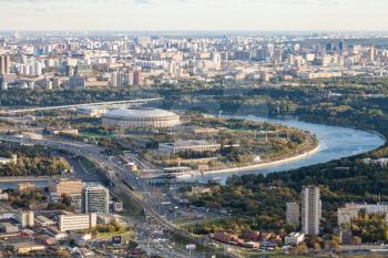 aerial view of Luzhniki arena stadium and southeast of Moscow city from observation deck at the top of OKO tower in autumn twilight