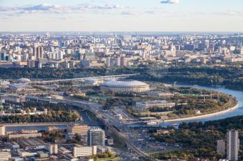 view of Luzhniki arena stadium and southeast of Moscow city from observation deck at the top of OKO tower in autumn twilight