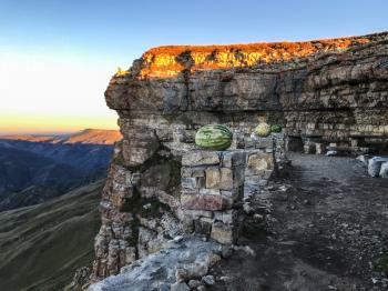 travel to North Caucasus region region - watermelons on observation deck of Bermamyt mountain Plateau at autumn dawn