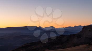 travel to North Caucasus region region - panoramic view of Caucasus Mountains from Bermamyt mountain Plateau at september dawn