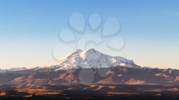 travel to North Caucasus region region - view of Mount Elbrus from Bermamyt Plateau at sunrise