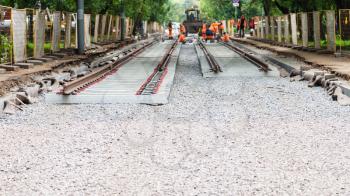 repair of tram tracks in Moscow city - laying of new rails of tramroad on concrete sleepers