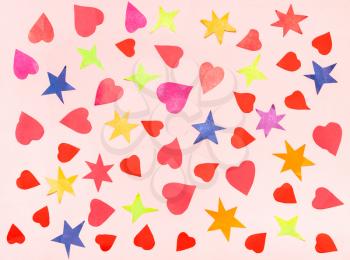 collage of various stars and hearts cut from color papers on pink pastel paper