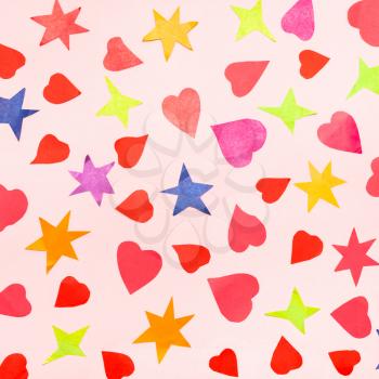 collage of many stars and hearts cut from color papers on pink pastel paper