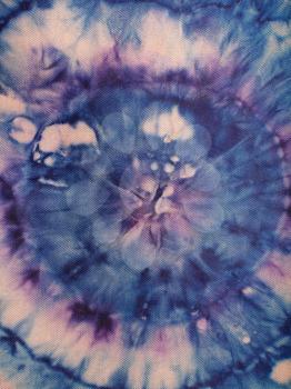 textile background - blue and purple concentric circles hand-painted on silk in tie-dye batik technique