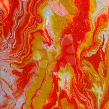 abstract picture hand-painted in fluid acrylic flow painting technique by red, silver and yellow paints on canvas