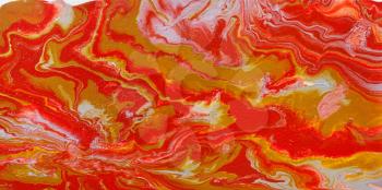 abstract picture hand-painted in fluid acrylic flow painting technique by red, silver, golden and yellow paints on white canvas