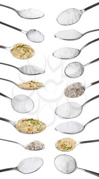 set from steel spoons with various salts isolated on white background