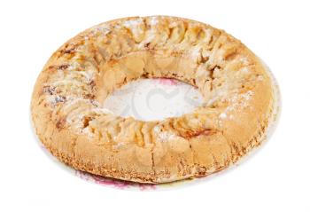 torus-shaped Russian Charlotte apple cake on plate isolated on white background