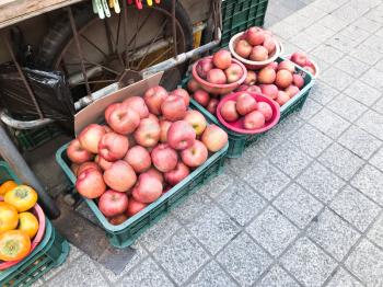 boxes with fresh pink apples at Taepo Fish Market in Sokcho city, South Korea (snapshot by smartphone).