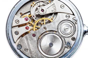 clockwork of mechanical Pocket watch close up isolated on white background