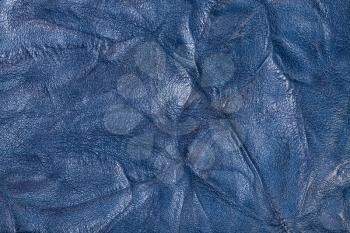 textured background from blue crumpled leather close up