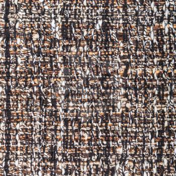 textile square background - woven yarns of pied boucle fabric close up