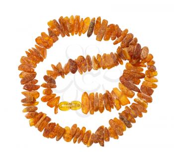 top view of tangled necklace from natural rough amber nuggets isolated on white background