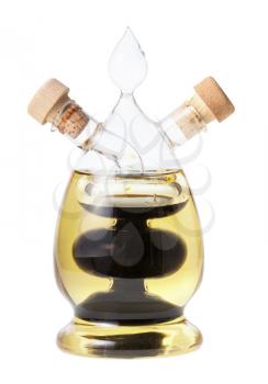 closed glass dispenser with olive oil and balsamic vinegar isolated on white background