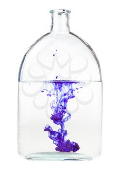 violet ink dissolves in water in bottle isolated on white background