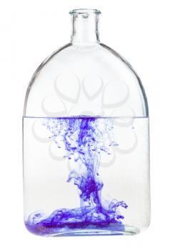 violet watercolour dissolves in water in glass flask isolated on white background