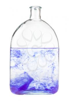 violet watercolour dissolves in water in bottle isolated on white background