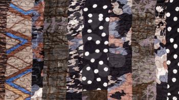 surface of handmade brown patchwork scarf from various stitched silk pieces