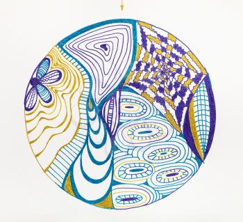 abstract circular pattern hand drawn by felt-tip pens on white paper