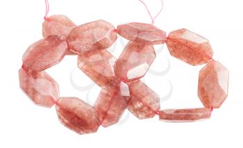tangled string from faceted pink aventurine beads isolated on white background