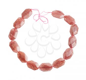 string from faceted pink aventurine beads isolated on white background