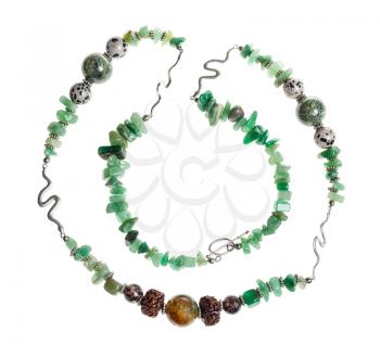 handcrafted necklace from tumbled green aventurine gemstones, cracked agate ball, aplite, rhodonite and rudraksha beads isolated on white background