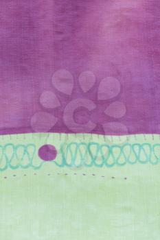detail of handpainted silk scarf - abstract purple and green texture background