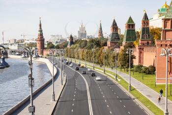 above view of Kremlin Embankment and Kremlin Towers along Moskva River in Moscow city from Bolshoy Moskvoretsky Bridge on sunny autumn day