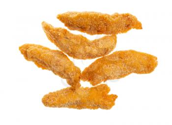 cooked chicken strips (breaded and deep fried pieces of chicken meat) isolated on white background