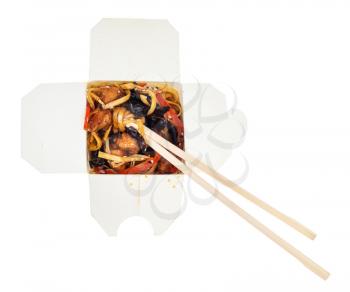 top view of japanese fast food - udon noodles with fried chicken pieces and vegetables in disposable cardboard box isolated on white background