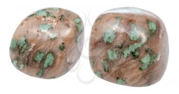 set of tumbled Nunderite (Nundoorite, Nundorite) gemstones isolated on white background