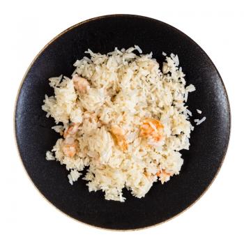 chinese cuisine - top view of boiled jasmine rice with shrimps on dark brown plate isolated on white background