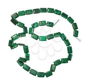 top view of coiled string of beads from artificial malachite isolated on white background