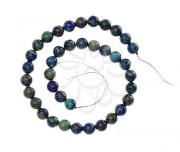 top view of spiral string of beads from natural azurite gemstone isolated on white background