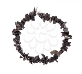 top view of string of beads from natural gray pieces of mother-of-pearl isolated on white background