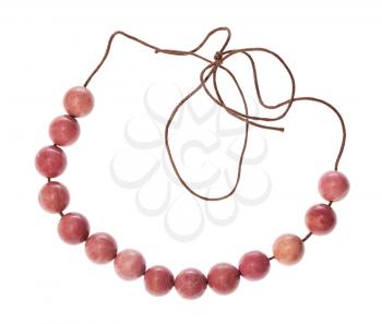 top view of string of beads from natural polished pink rhodonite gemstone isolated on white background