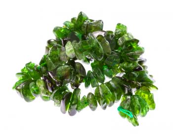 tangled string of beads from natural tumbled chrome diopside gemstone isolated on white background