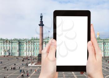 travel concept - tourist photographs of Palace Square with Alexander Column and facade of Winter Palace in Saint Petersburg on smartphone with empty cutout screen with blank place for advertising