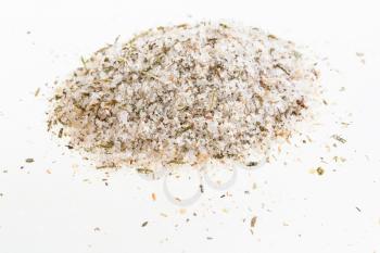 handful of seasoned salt with spices and dried herbs on white background