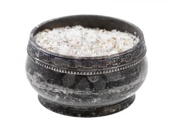 side view of old silver salt cellar with seasoned salt with spices and dried herbs isolated on white background