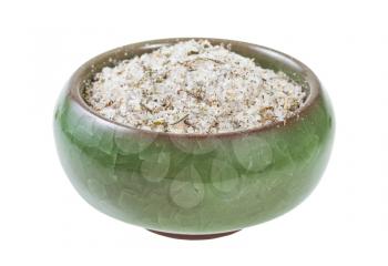 side view of ceramic salt cellar with seasoned salt with spices and dried herbs isolated on white background