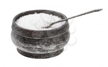 side view of old silver salt cellar with spoon with grained Rock Salt isolated on white background