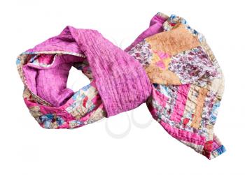 tied stitched patchwork scarf from various silk strips and crushed pink cotton fabric isolated on white background